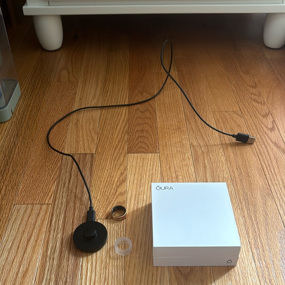 Oura Black Ring Charger and White Charging Dock